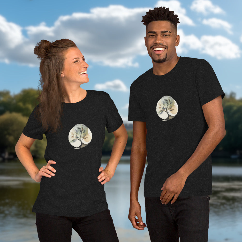 Essence of Nature - Elegant, stylized tree design with fluid curves and semi-transparent leaves in gentle earth-tone colors, set within a circular shape. Two Models with graphic printed on black-heather-colored Unisex Staple T-Shirt Bella + Canvas 3001