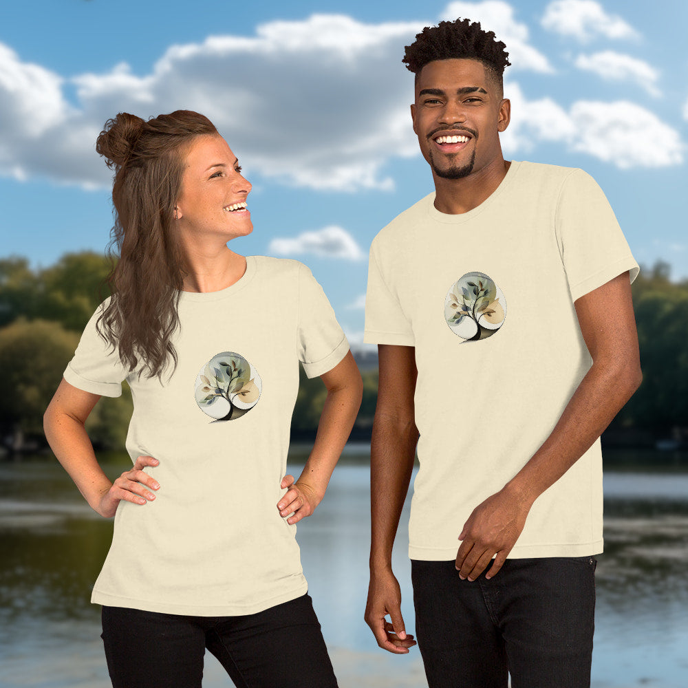 Essence of Nature - Elegant, stylized tree design with fluid curves and semi-transparent leaves in gentle earth-tone colors, set within a circular shape. Two Models with graphic printed on natural-colored Unisex Staple T-Shirt Bella + Canvas 3001