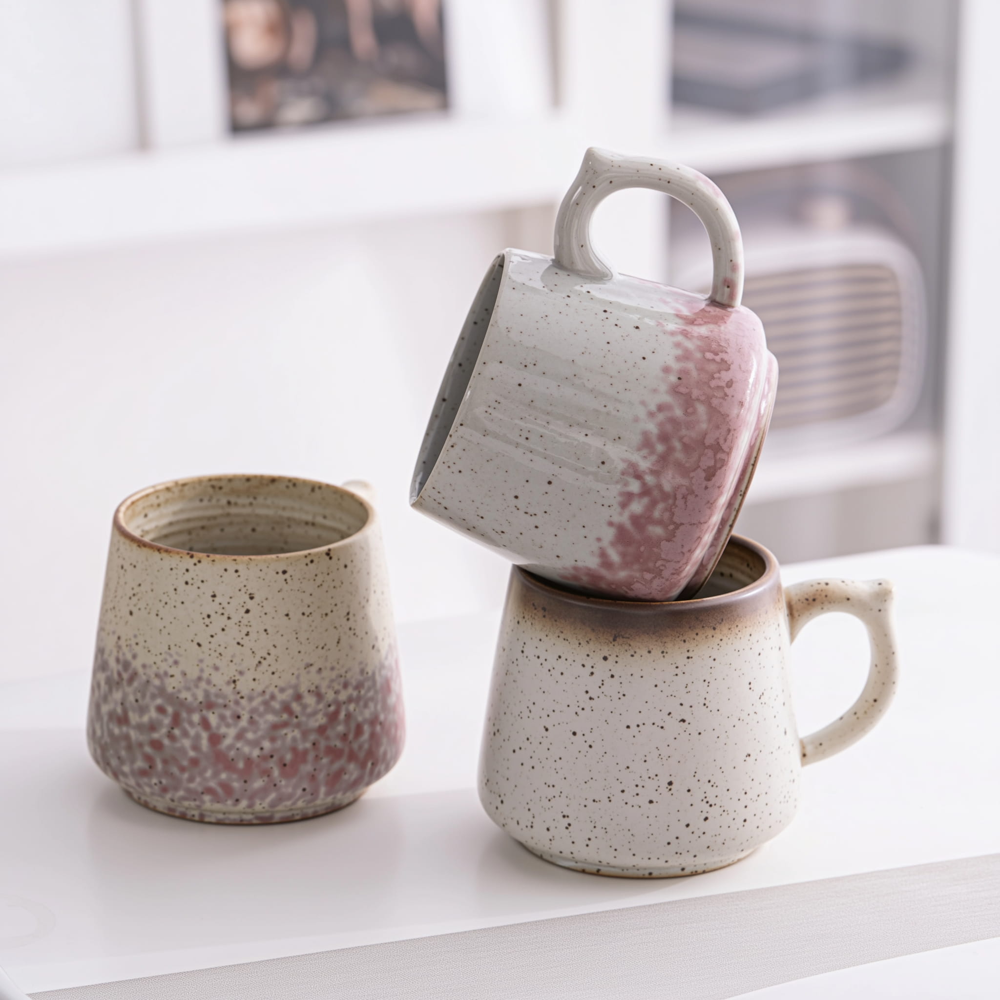 Ceramic coffee mug set in warm natural light interior