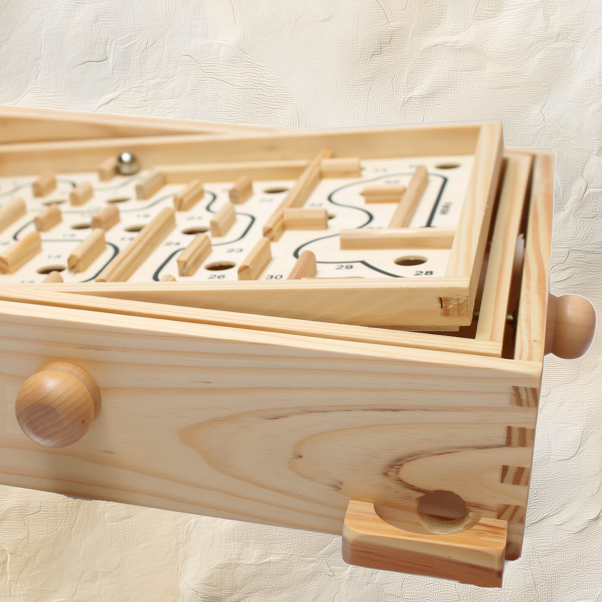 Wooden pinball labyrinth game with tilt knobs