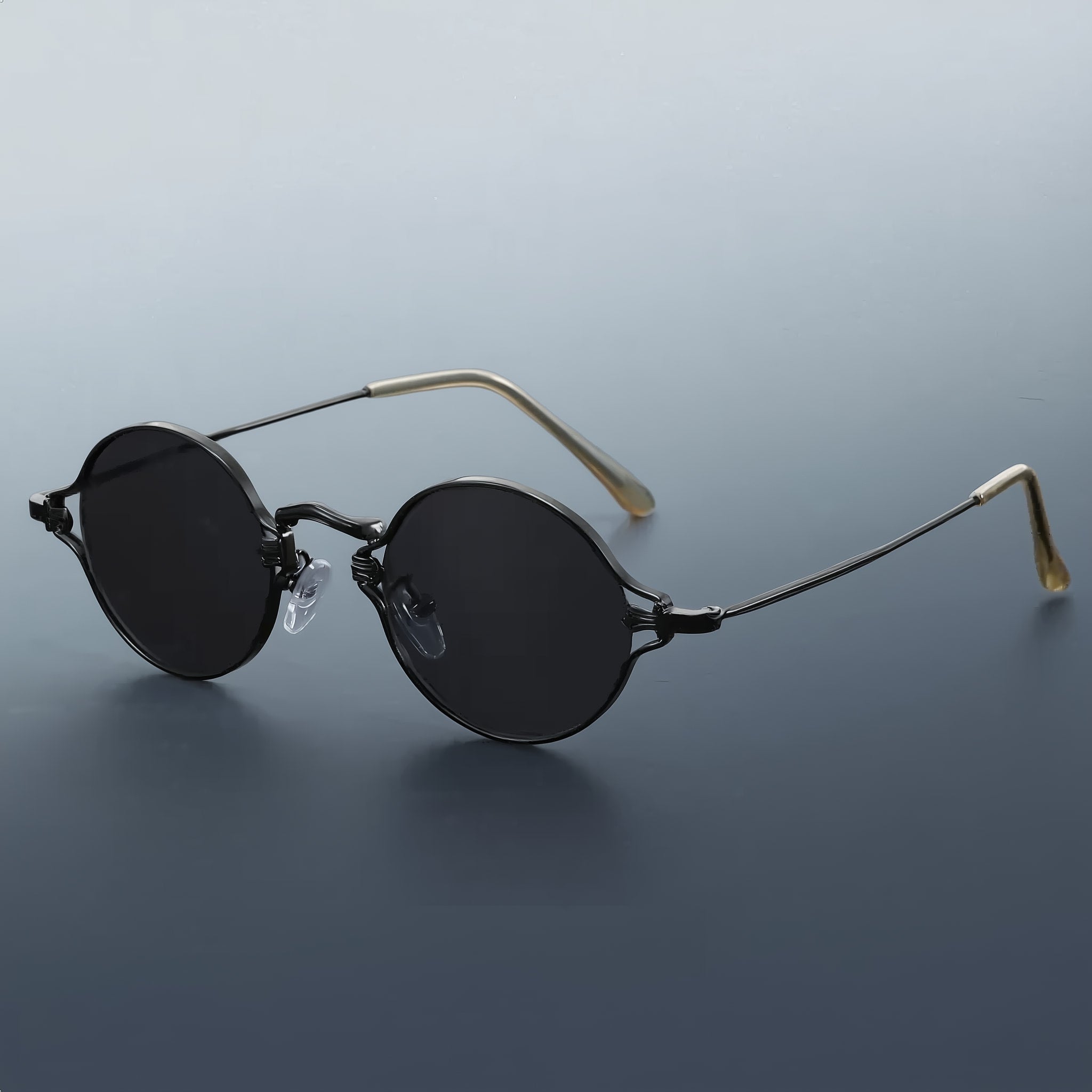 Vintage style round sunglasses with black frame and gray lenses