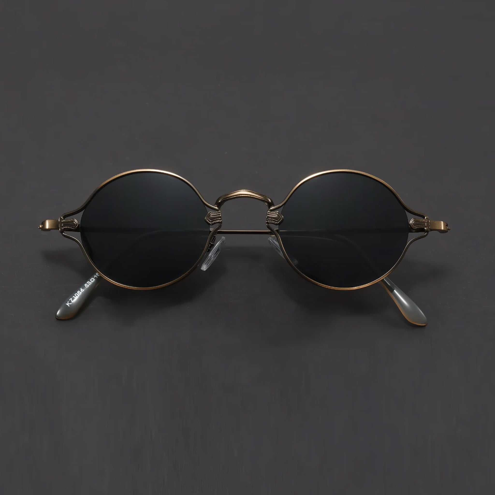 Vintage unisex sunglasses with brushed bronze frame and gray lenses in front view