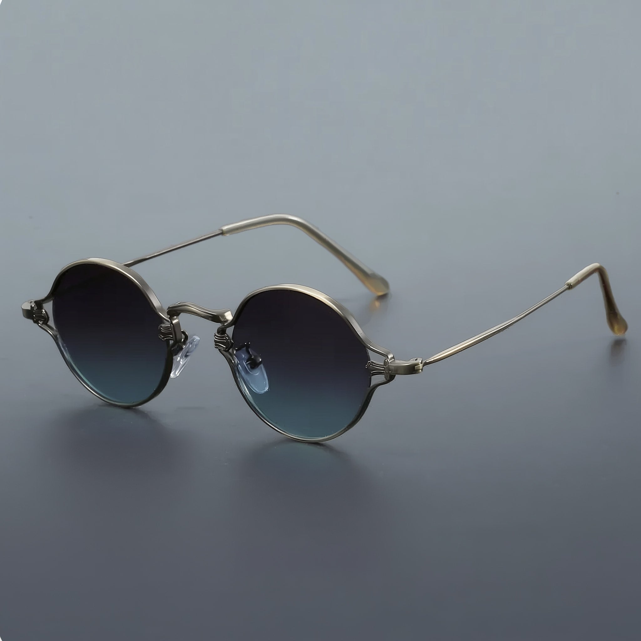 Vintage style round sunglasses with gunmetal frame and blue-gray lenses