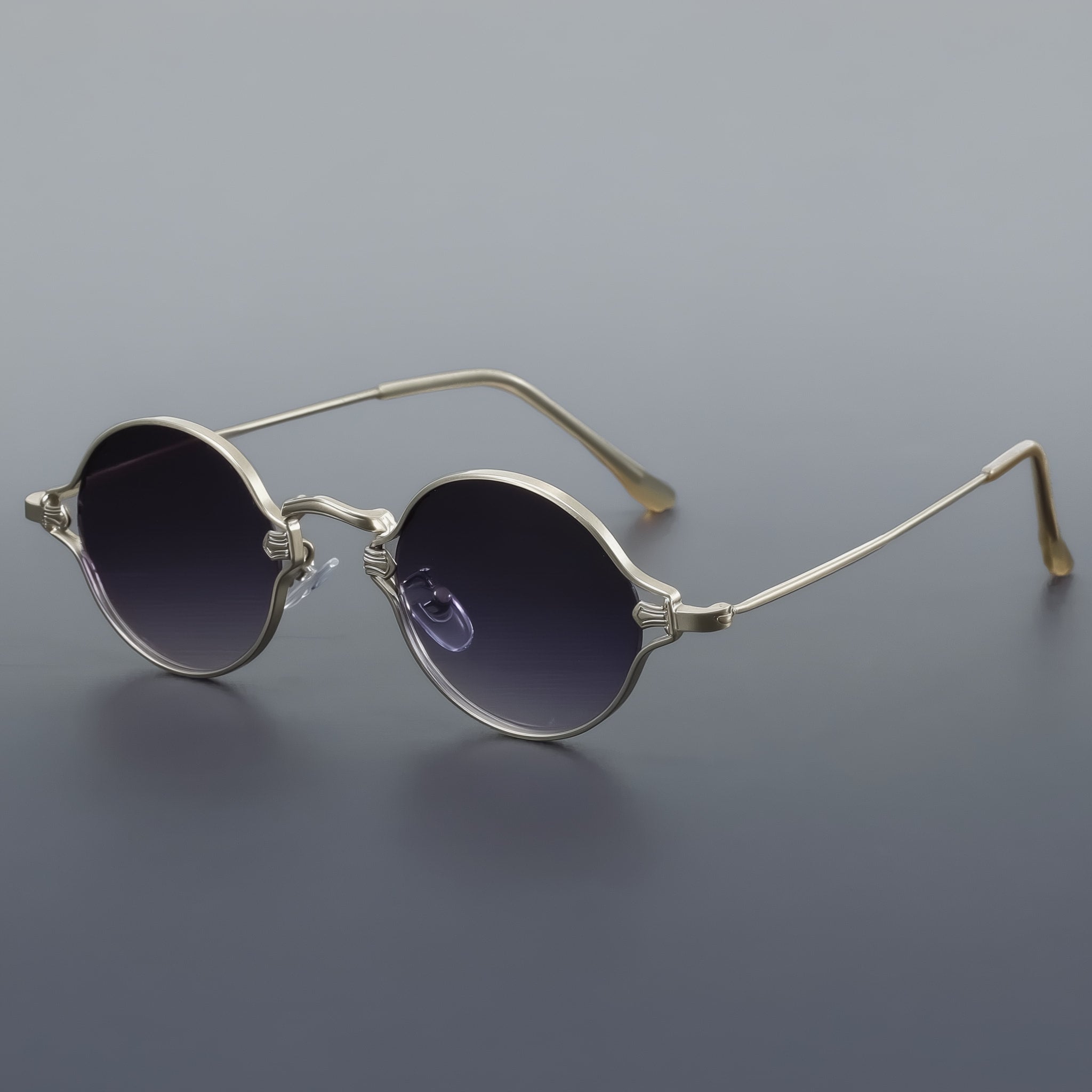 Vintage style round sunglasses with silver frame and gradient gray lenses