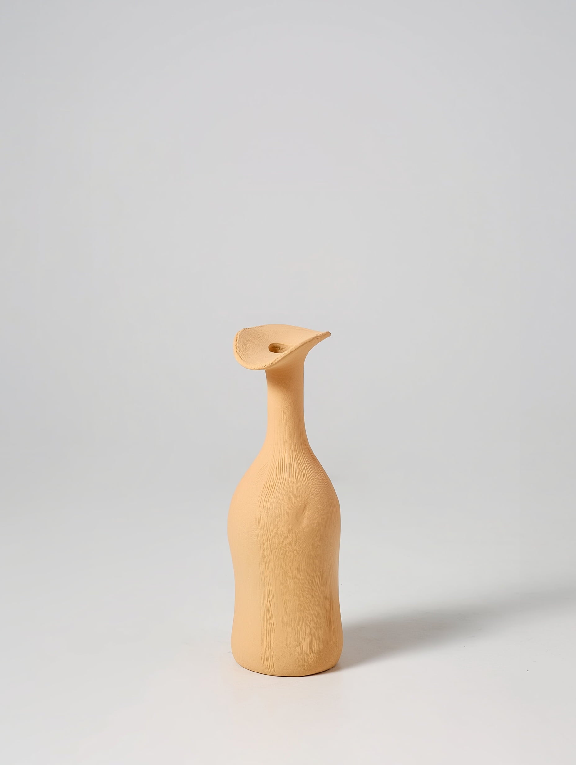 Morandi ceramic vase in yellow on neutral background